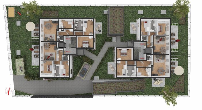 Übersicht eines Wohnkomplexes mit mehreren Gebäuden und Grünflächen.