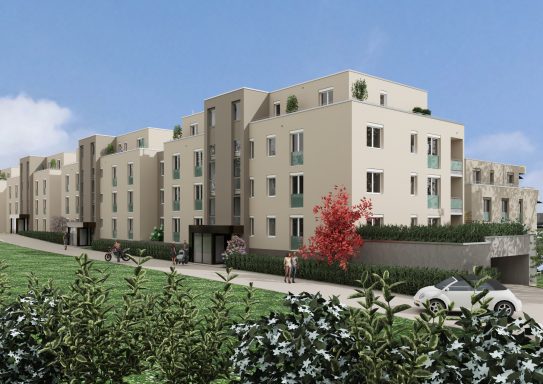 Moderne Wohnanlage mit mehreren Gebäuden und grünen Anlagen.